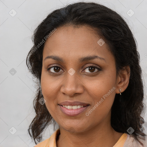 Joyful black young-adult female with medium  brown hair and brown eyes