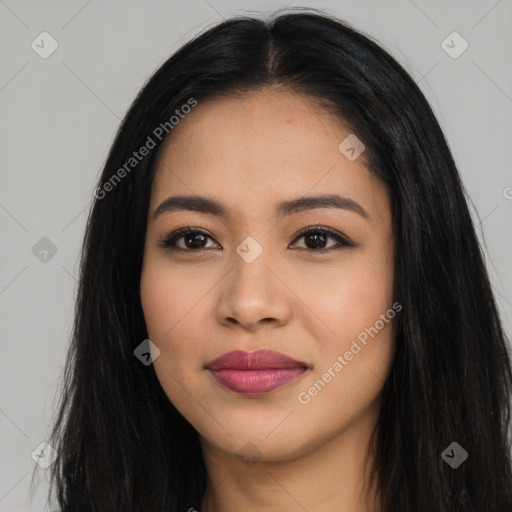 Joyful latino young-adult female with long  brown hair and brown eyes