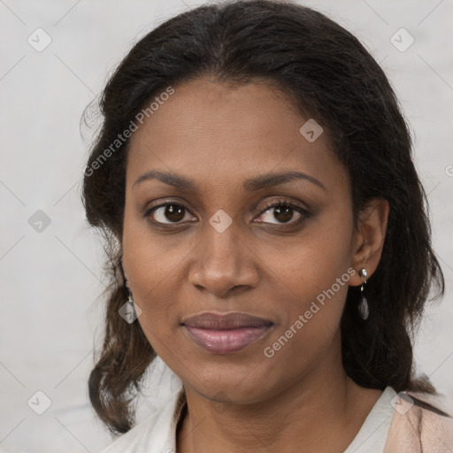 Joyful black young-adult female with medium  brown hair and brown eyes