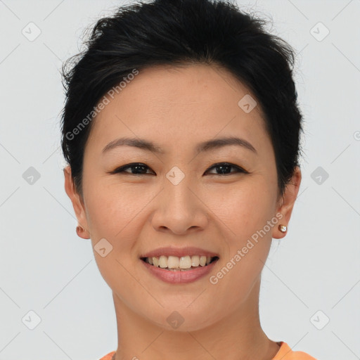 Joyful asian young-adult female with short  brown hair and brown eyes