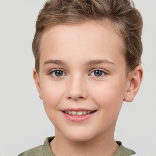 Joyful white child female with short  brown hair and grey eyes