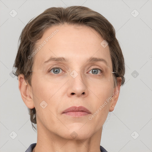 Neutral white adult female with short  brown hair and grey eyes