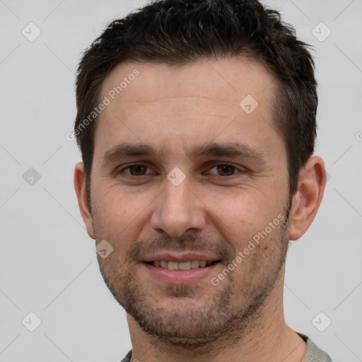 Joyful white young-adult male with short  brown hair and grey eyes