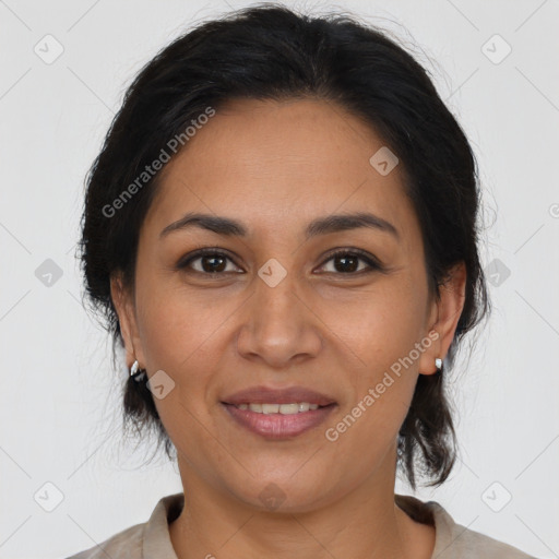 Joyful latino young-adult female with medium  brown hair and brown eyes