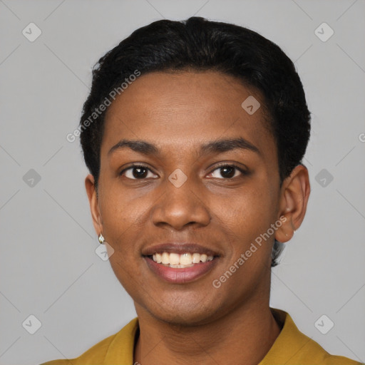 Joyful black young-adult female with short  black hair and brown eyes