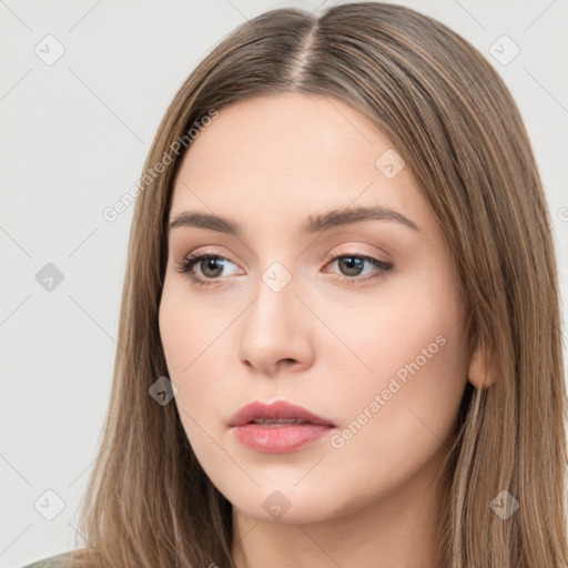 Neutral white young-adult female with long  brown hair and brown eyes