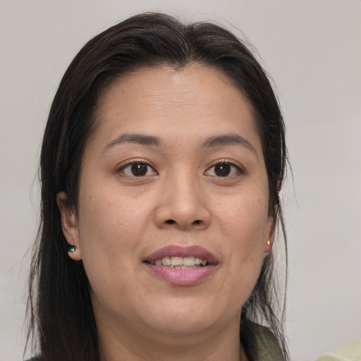 Joyful white young-adult female with medium  brown hair and brown eyes