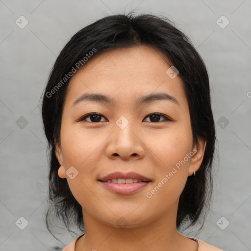 Joyful asian young-adult female with medium  brown hair and brown eyes