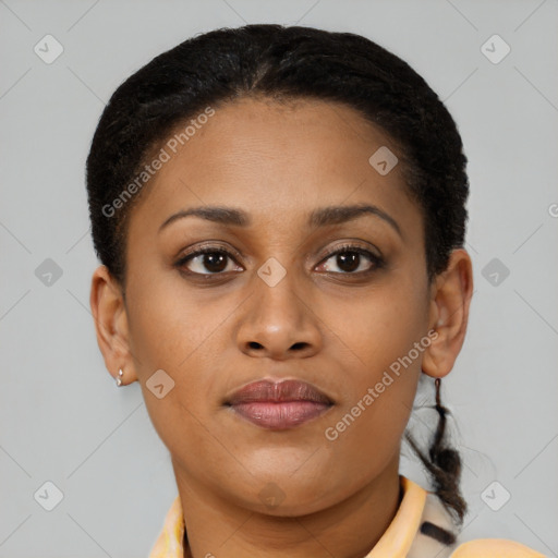 Joyful black young-adult female with short  brown hair and brown eyes