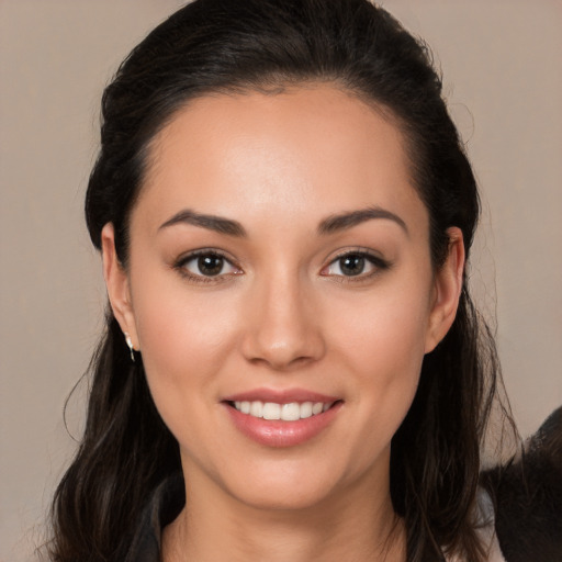 Joyful white young-adult female with long  brown hair and brown eyes