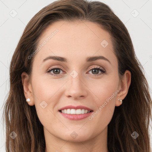 Joyful white young-adult female with long  brown hair and grey eyes