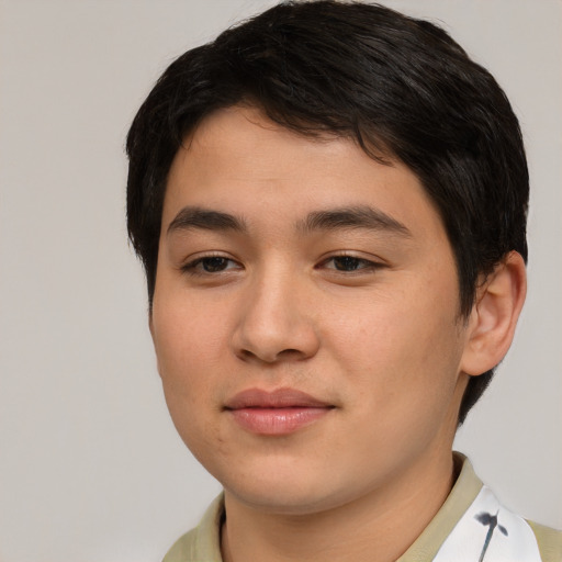 Joyful asian young-adult male with short  brown hair and brown eyes
