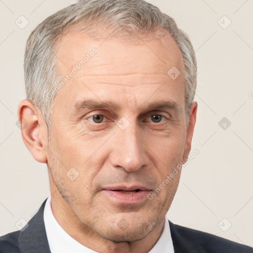 Neutral white middle-aged male with short  gray hair and brown eyes