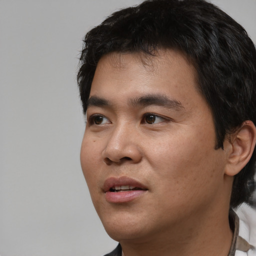 Neutral asian young-adult male with short  black hair and brown eyes