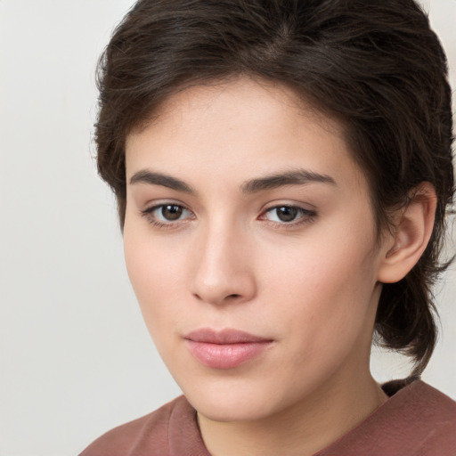 Neutral white young-adult female with medium  brown hair and brown eyes