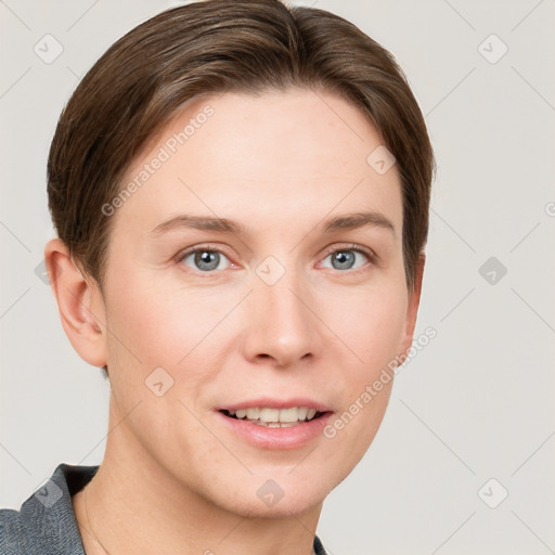 Joyful white young-adult female with short  brown hair and grey eyes