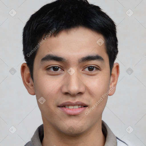 Joyful asian young-adult male with short  black hair and brown eyes