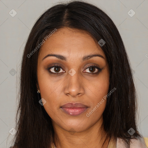 Joyful black young-adult female with long  brown hair and brown eyes