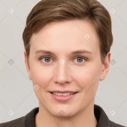 Joyful white young-adult female with short  brown hair and grey eyes