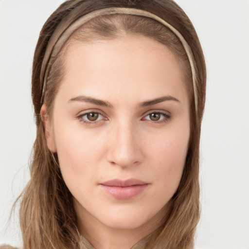 Neutral white young-adult female with long  brown hair and brown eyes