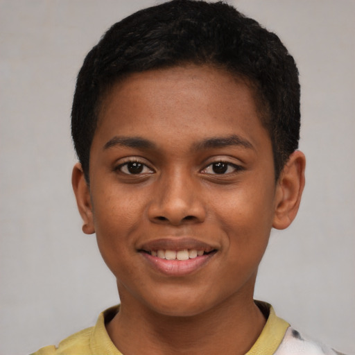 Joyful latino child male with short  brown hair and brown eyes