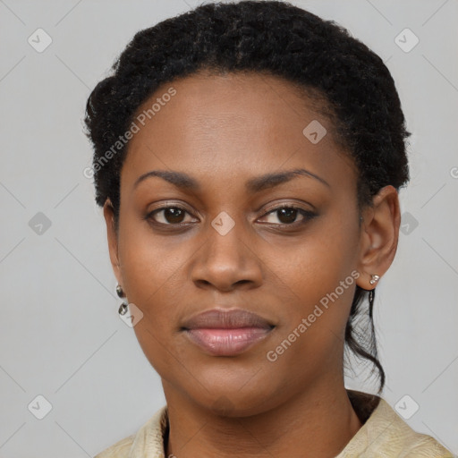 Joyful black young-adult female with short  black hair and brown eyes