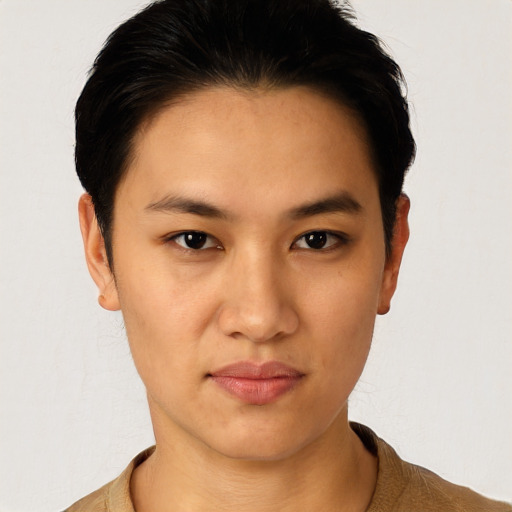 Joyful asian young-adult female with short  black hair and brown eyes