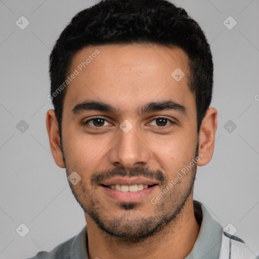 Joyful white young-adult male with short  black hair and brown eyes