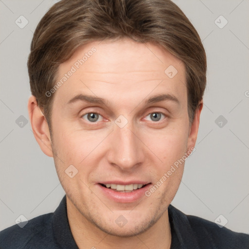 Joyful white adult male with short  brown hair and grey eyes