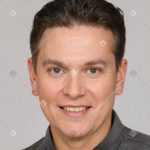 Joyful white adult male with short  brown hair and brown eyes