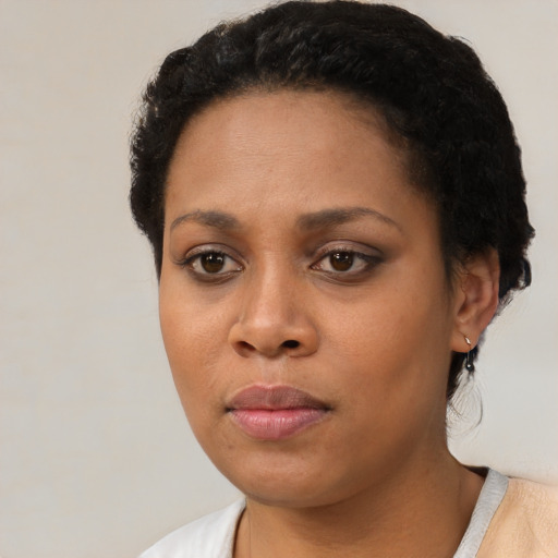 Neutral black young-adult female with short  black hair and brown eyes
