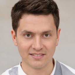 Joyful white adult male with short  brown hair and brown eyes