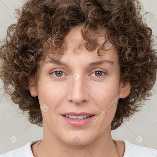 Joyful white young-adult female with medium  brown hair and green eyes