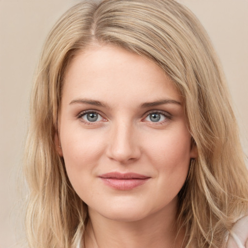 Joyful white young-adult female with medium  brown hair and green eyes