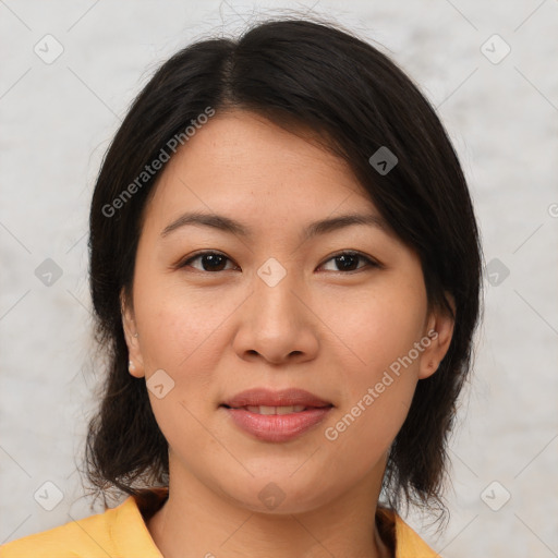 Joyful asian young-adult female with medium  brown hair and brown eyes