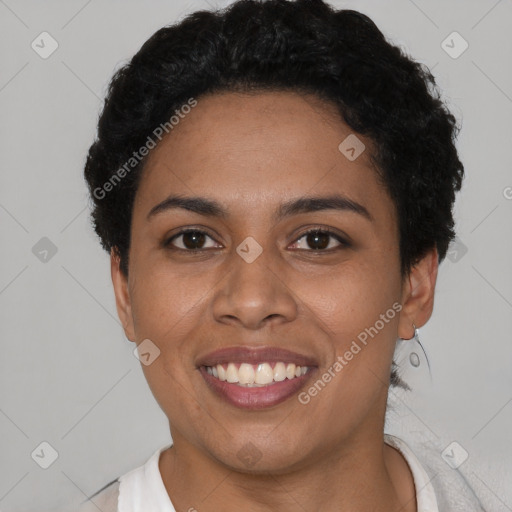 Joyful latino young-adult female with short  black hair and brown eyes