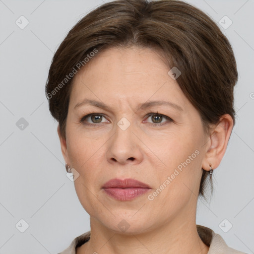 Joyful white adult female with short  brown hair and grey eyes