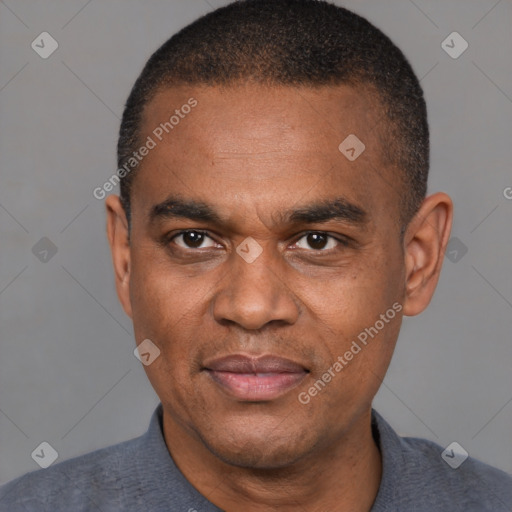 Joyful latino adult male with short  black hair and brown eyes