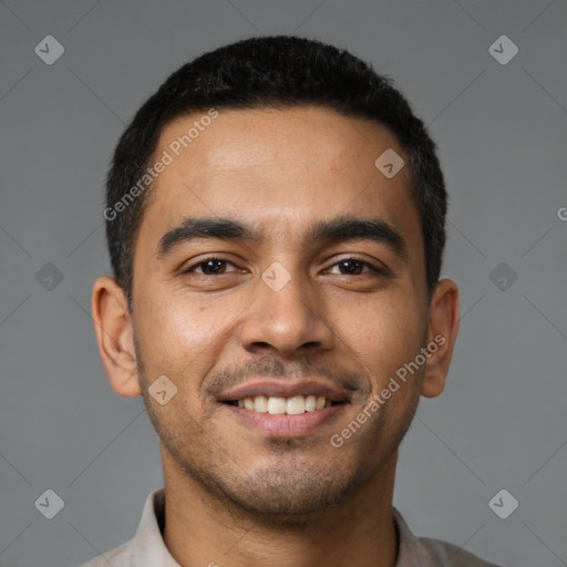 Joyful latino young-adult male with short  black hair and brown eyes