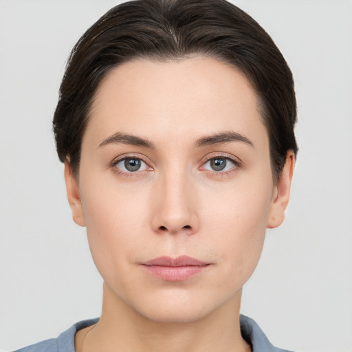 Neutral white young-adult female with short  brown hair and brown eyes