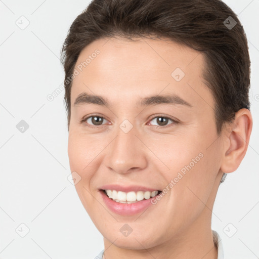 Joyful white young-adult female with short  brown hair and brown eyes