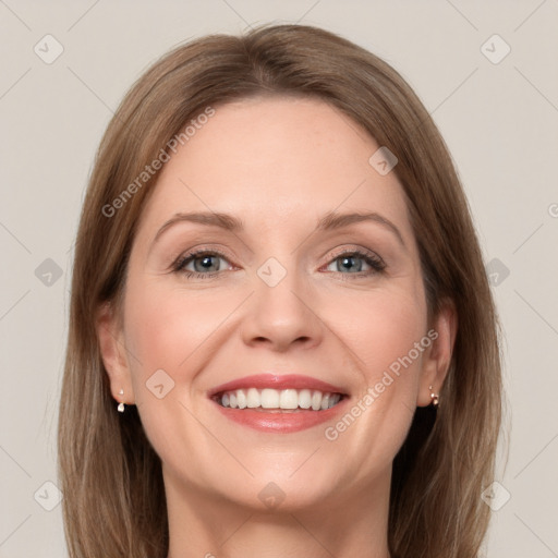 Joyful white young-adult female with long  brown hair and grey eyes