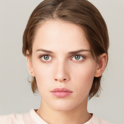 Neutral white young-adult female with medium  brown hair and green eyes