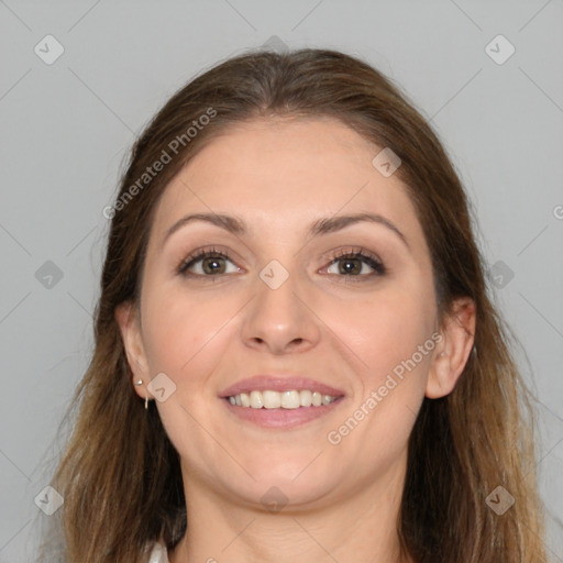 Joyful white young-adult female with long  brown hair and brown eyes