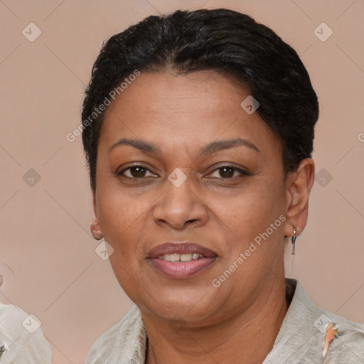 Joyful latino adult female with short  brown hair and brown eyes