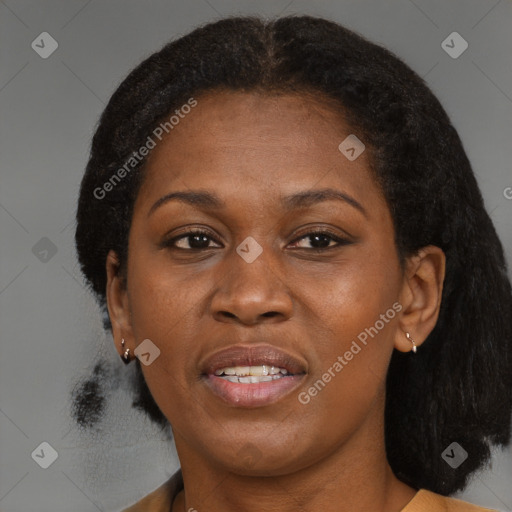 Joyful black adult female with medium  brown hair and brown eyes