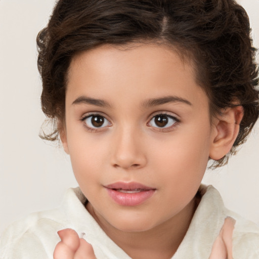 Joyful white child female with medium  brown hair and brown eyes