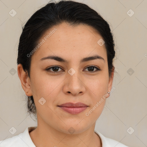 Joyful latino young-adult female with medium  brown hair and brown eyes