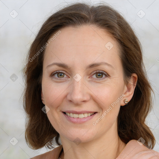 Joyful white adult female with long  brown hair and grey eyes