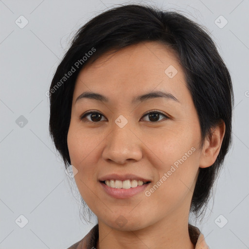 Joyful asian young-adult female with medium  black hair and brown eyes